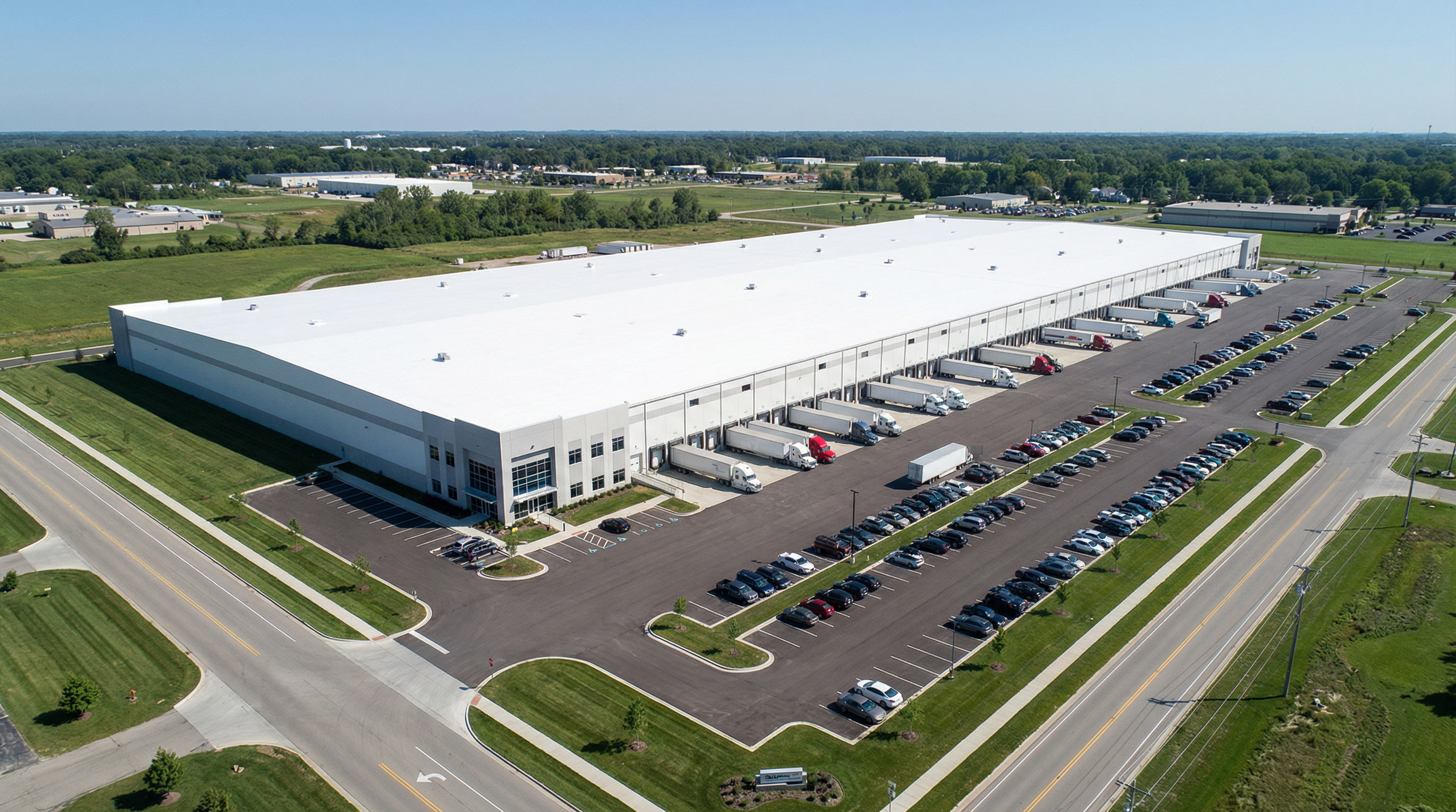 Aerial view of a large white coated warehouse roof with loading docks in Elkhart, Indiana